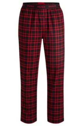 Pantalones de pijama de algodón a cuadros con logos en la cintura